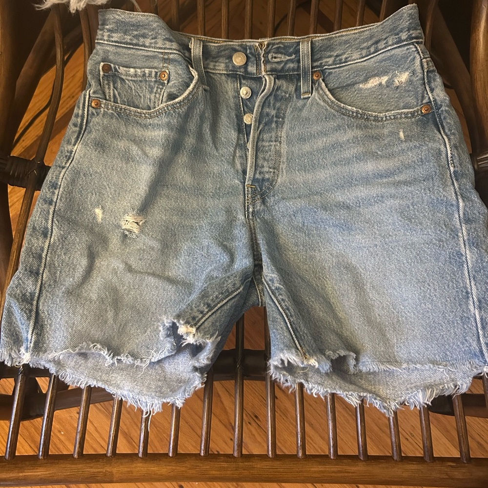 Levi’s 501 mid thigh shorts, distressed denim.